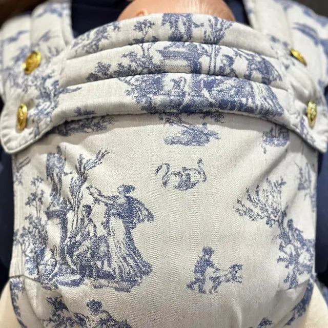 The woven motif up close: two figures beneath a tree.